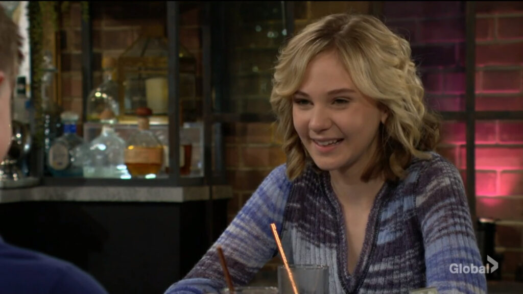 Lucy laughs as she talks with Johnny and Connor.
