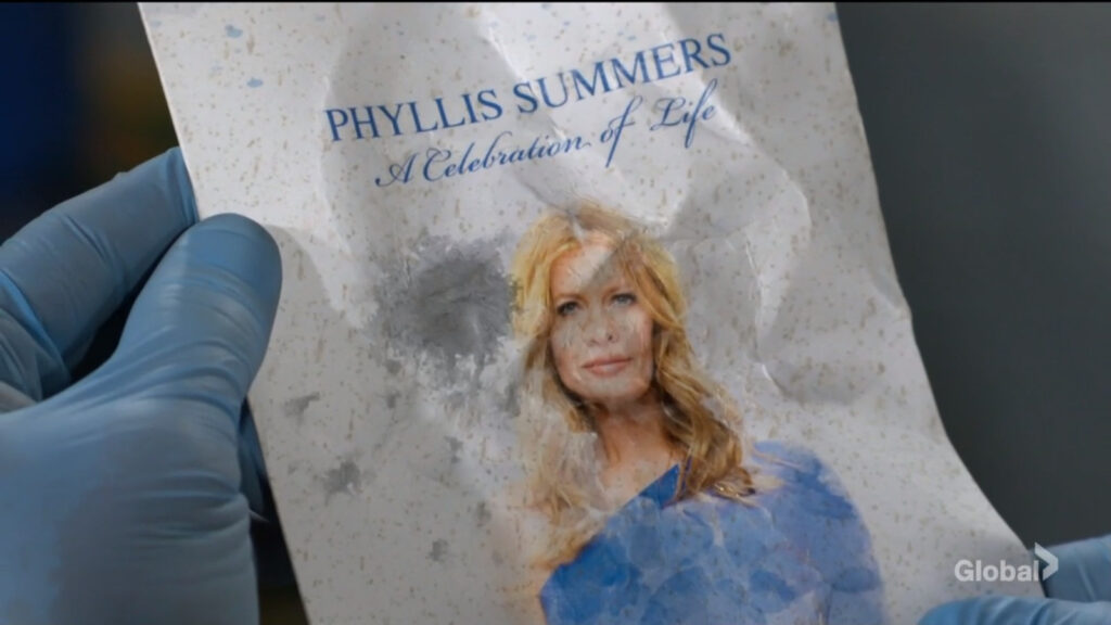 Chance looks at Phyllis's crumpled up memorial pamphlet.