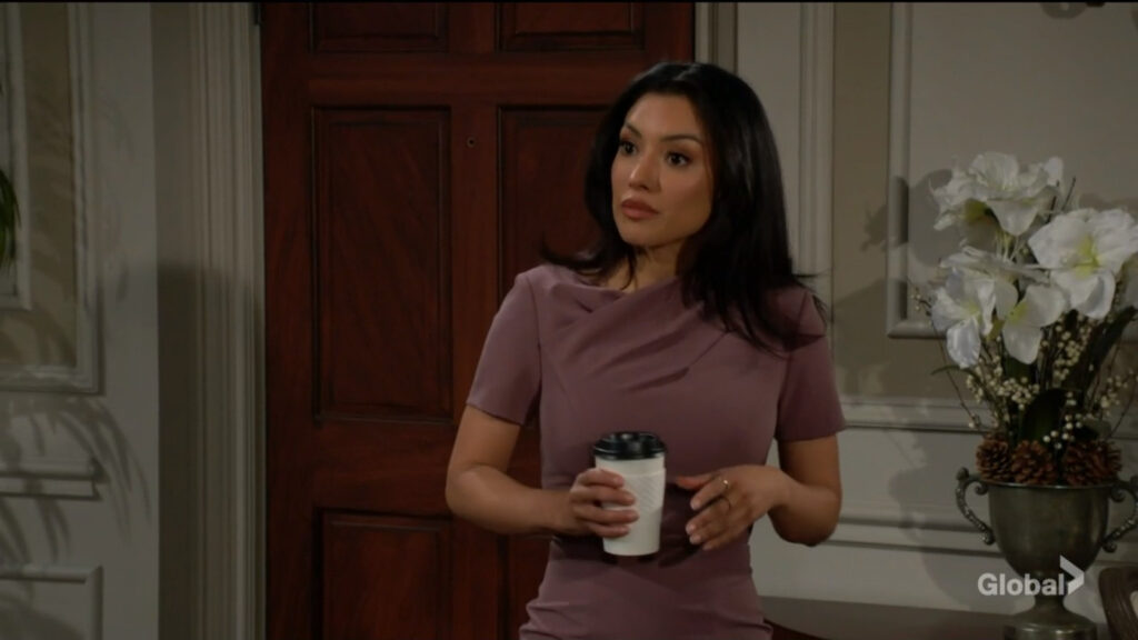 Audra holds a coffee as she talks with Nate.