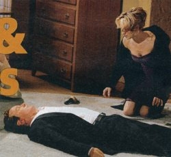 Cameron lies on the floor, motionless, after Sharon hit him with a bottle of champagne.