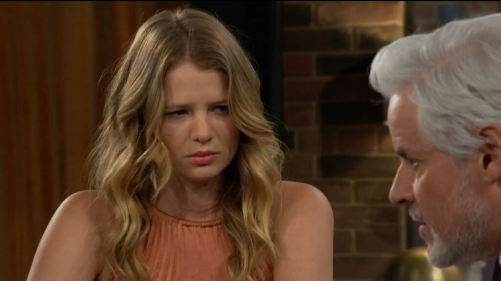 Summer looks grumpy as she talks with Michael.