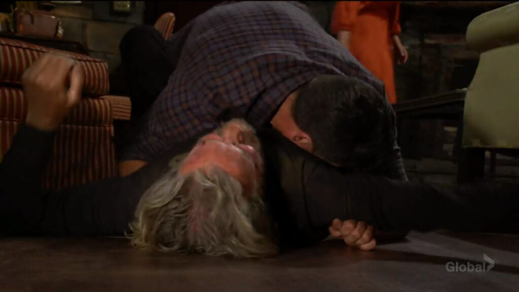 Nick slams Cameron to the ground.