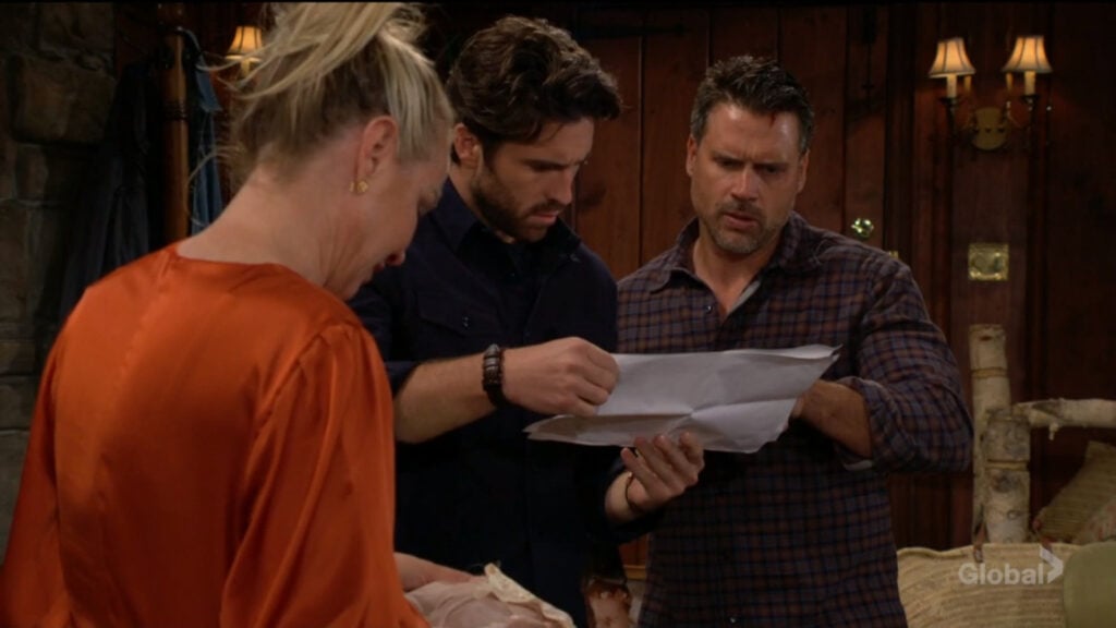 Sharon looks at her clothing that Cameron had stashed, while Chance and Nick look over the blueprints.
