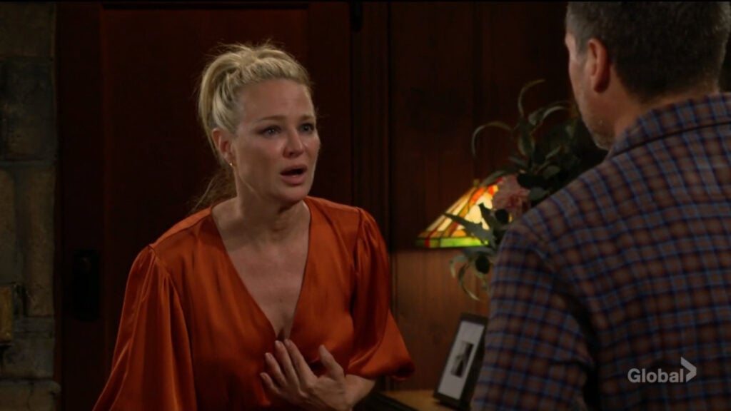 Sharon holds her hand to her chest as she talks with Nick and Chance.