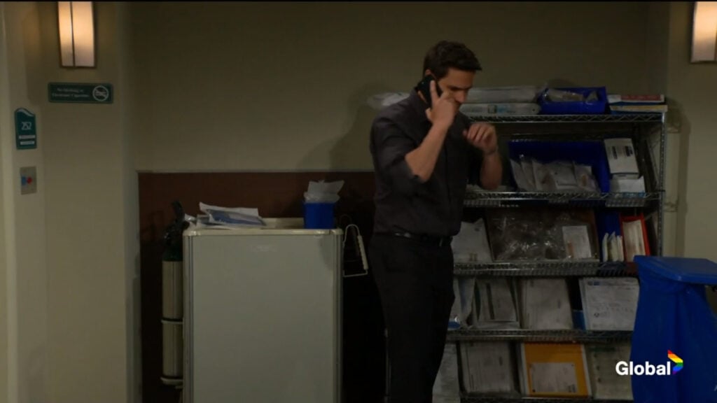 Adam paces as he makes a phone call.