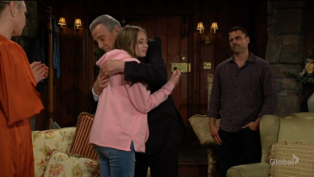 Victor hugs Faith as Sharon and Nick look on.
