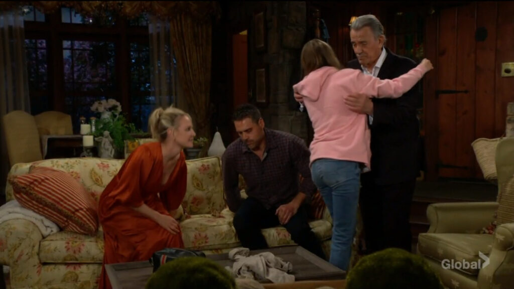 Faith hugs Victor as Sharon and Nick look on.