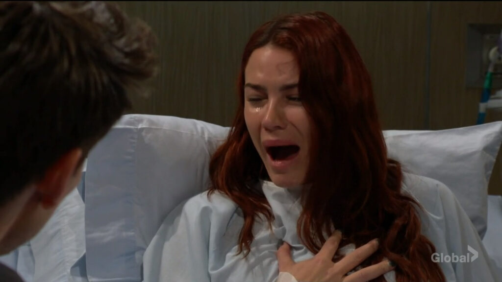 Sally cries as she lies in the hospital bed.