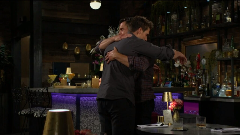 Nick hugs Adam.