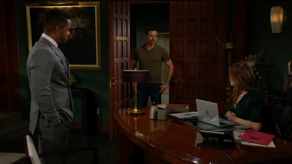 Nate and Victoria look as Nick enters the office.