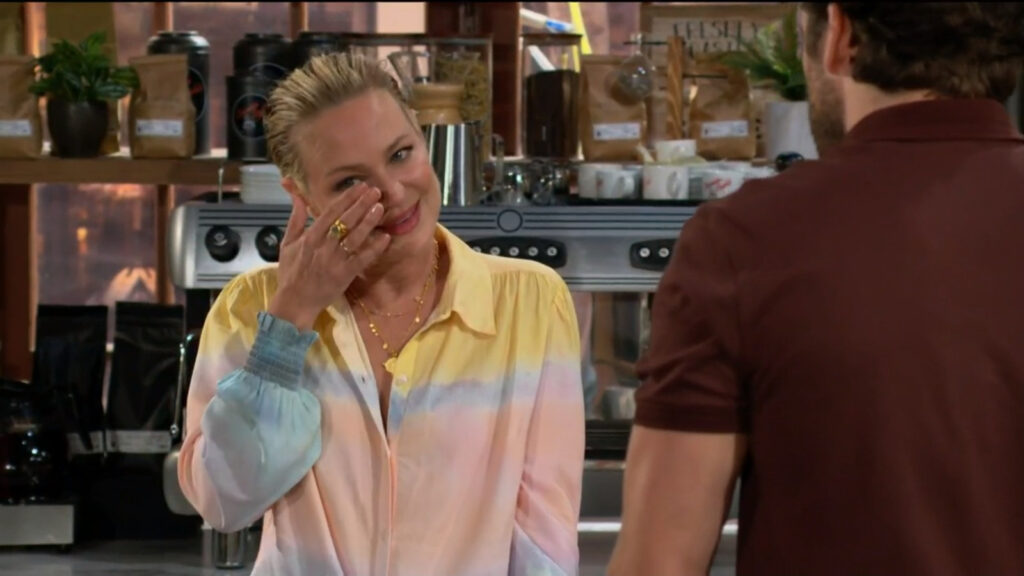 Sharon wipes a tear from her eye as she talks with Chance.