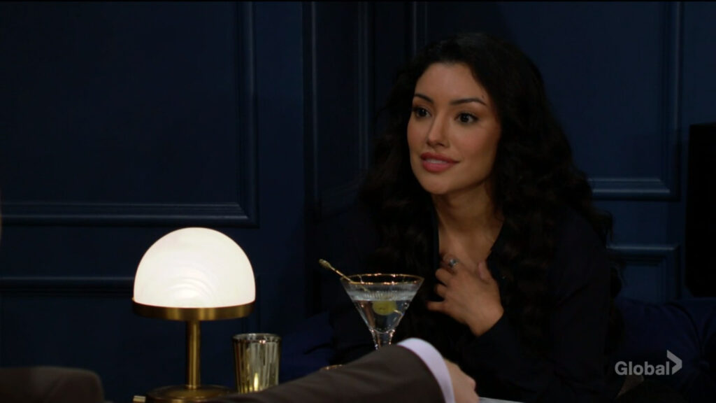 Audra talks to Kyle over a martini.