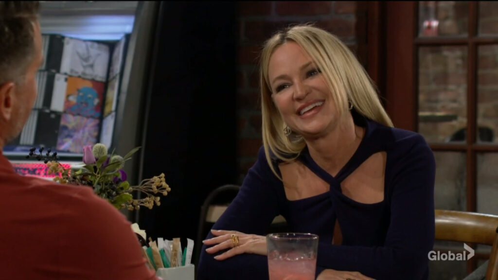 Sharon laughs as she talks with Nick.