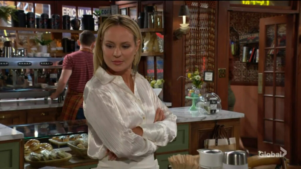 Sharon looks away as Sally leaves the cafe.