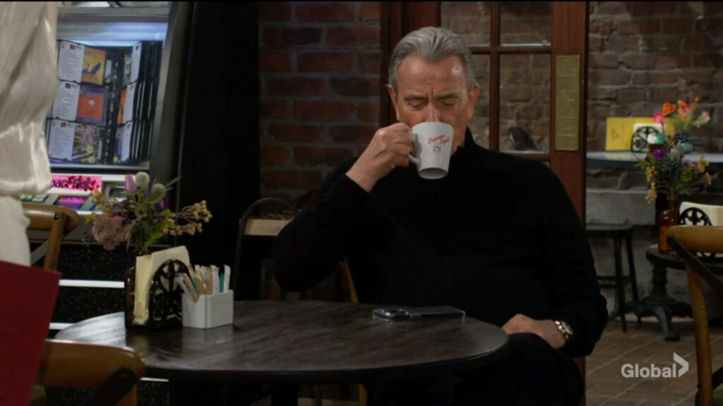 Victor takes a sip of coffee.