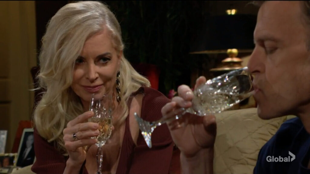 Ashley smiles as Tucker takes a drink.