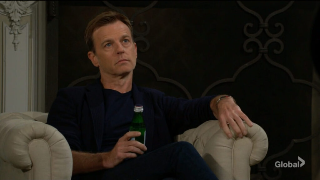 Tucker holds a beer as he sits and talks with Phyllis.