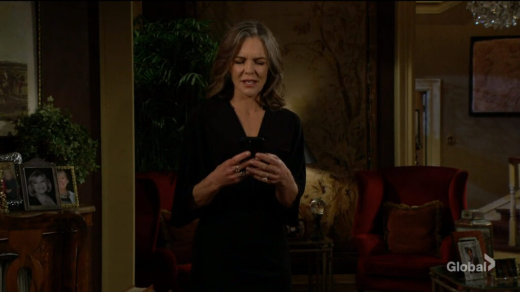 Diane reacts as she receives a picture of Phyllis's arrest from Tucker.