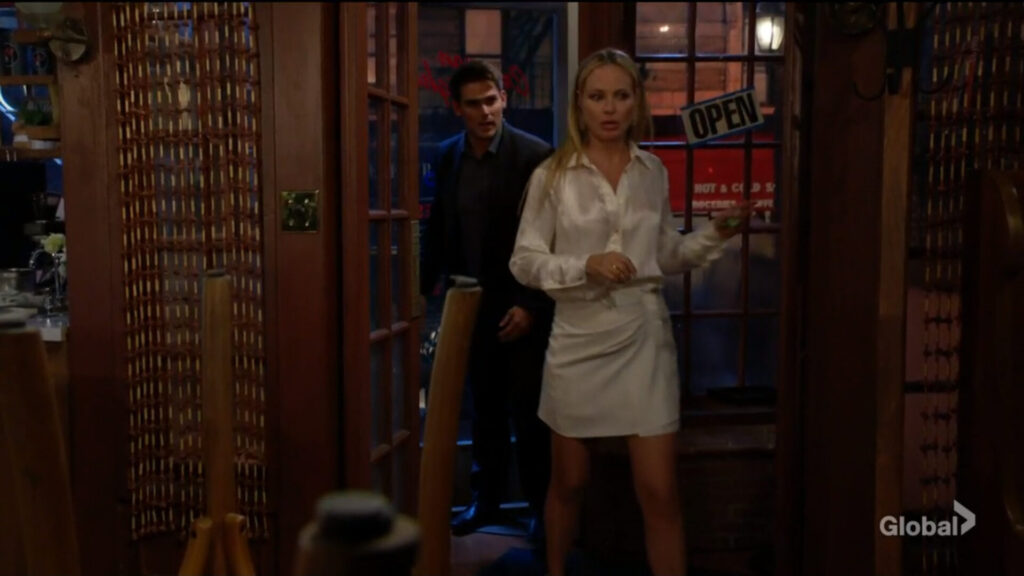 Sharon answers the door and lets Adam into the cafe.