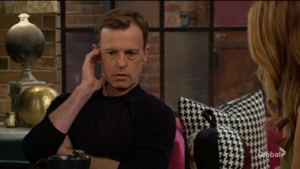 Tucker rubs his ear as he talks with Phyllis.
