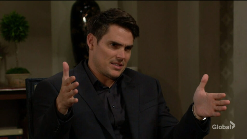 Adam gestures as he talks with Victor.