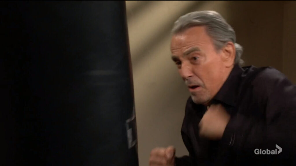 Victor punches the bag.