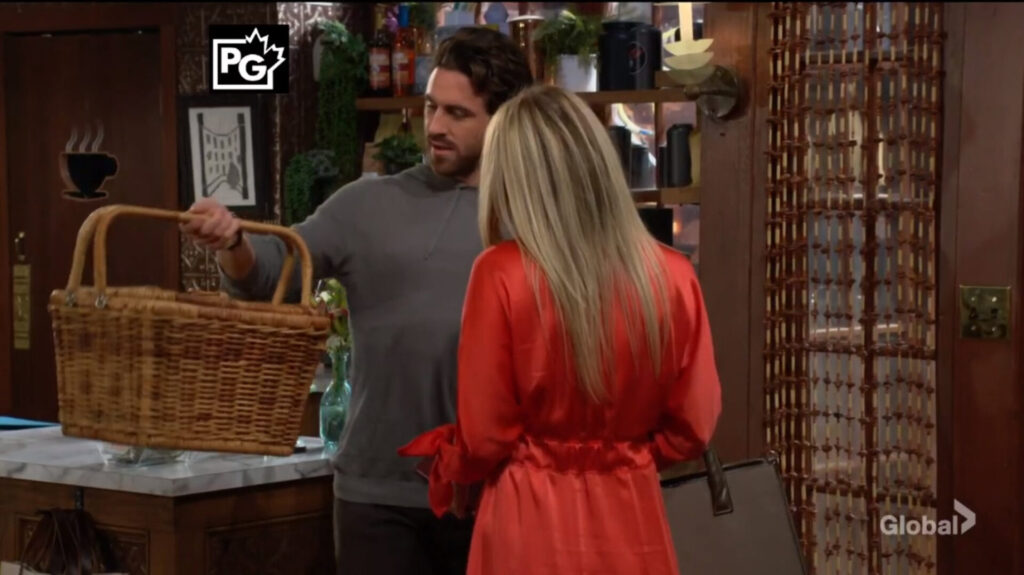 Chance holds a picnic basket as he talks with Sharon.