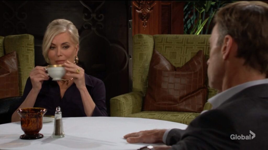 Ashley sips from a teacup as she talks to Tucker.