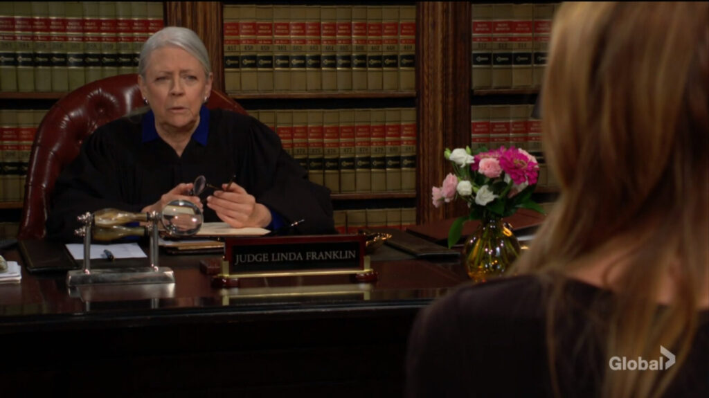 The judge and Phyllis talk.