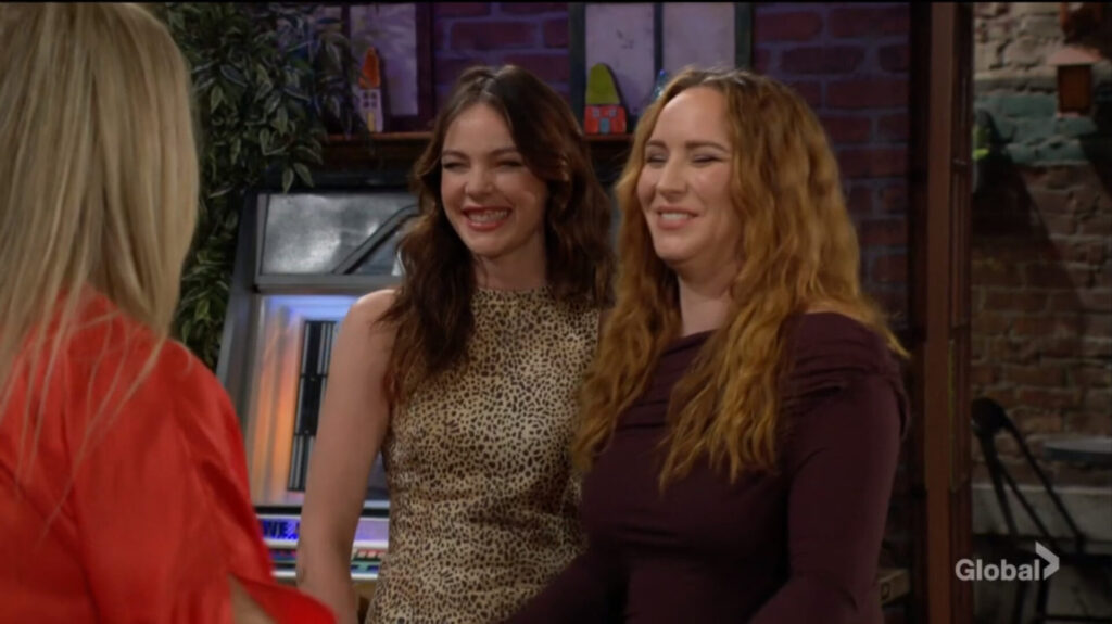 Tessa and Mariah grin at Sharon.