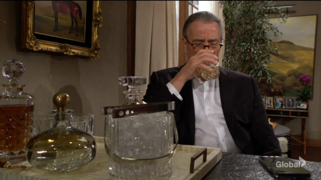 Victor takes a drink.