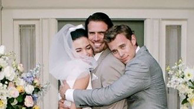 Victoria and Billy goof around with Nick at their wedding.