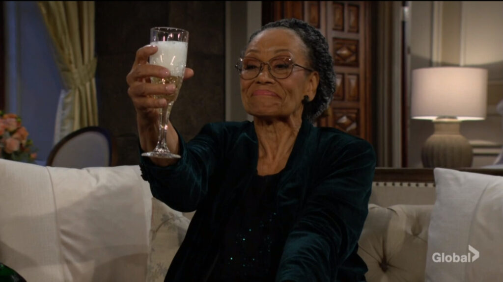 Mamie raises her glass.