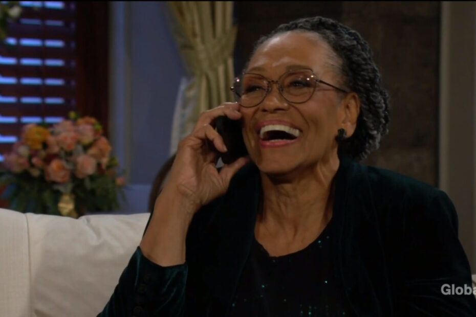 Mamie laughs as she talks on the phone.