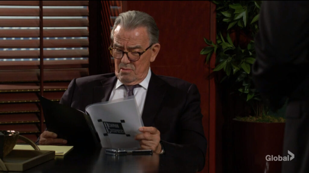 Victor looks through a report.