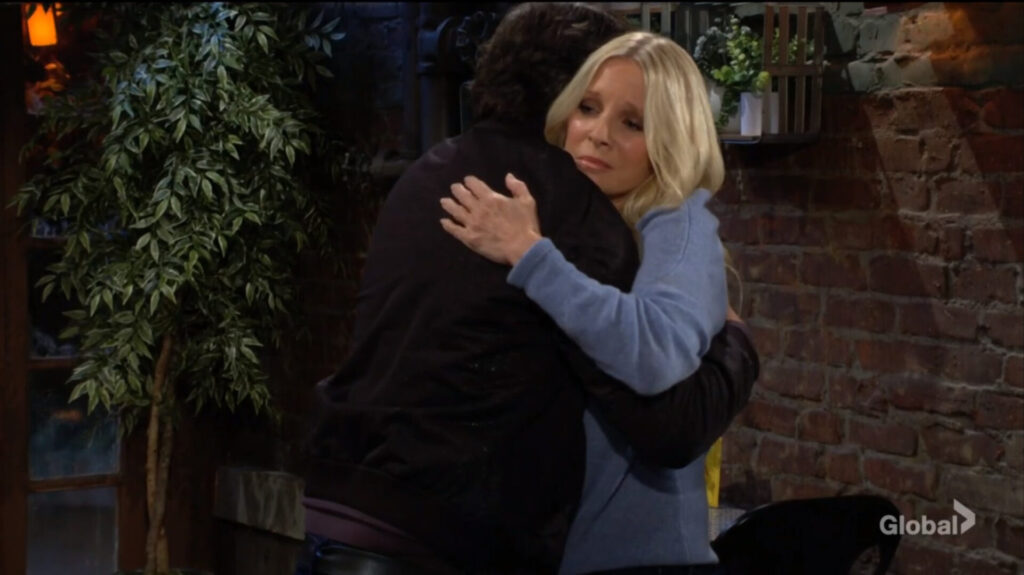 Christine and Danny hug.