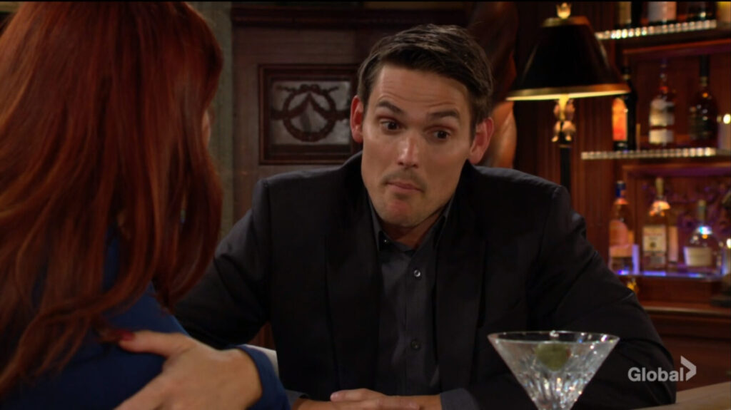 Adam pulls a face as he talks with Sally.