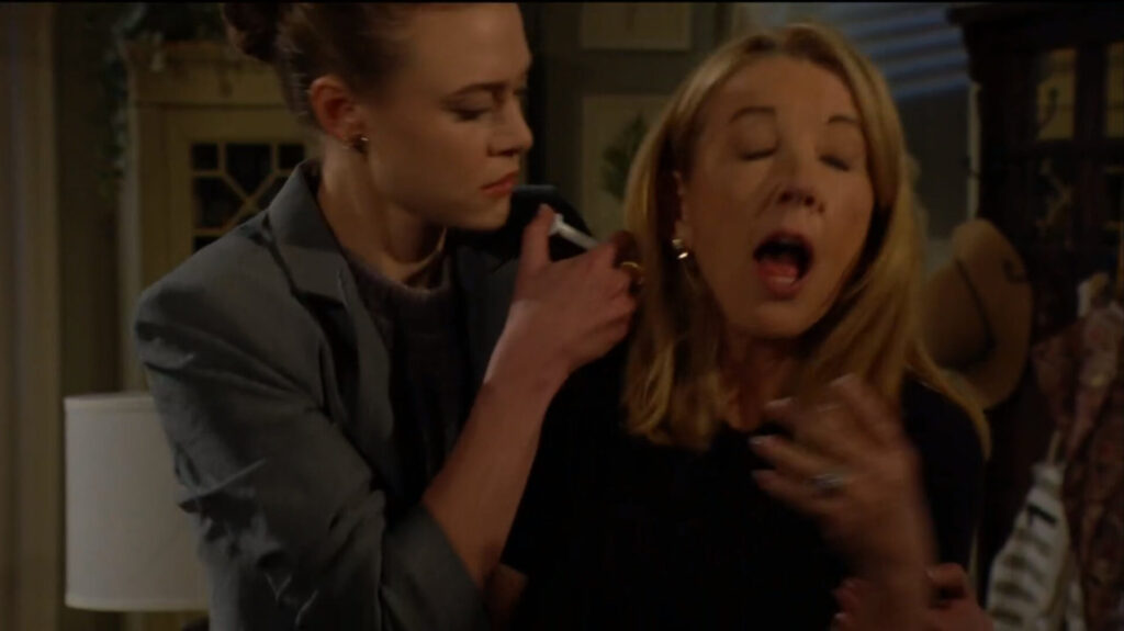Claire injects Nikki in the neck.