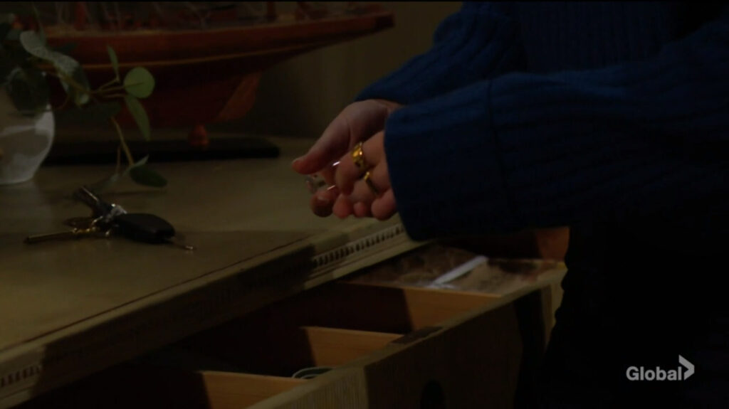 Claire gets antidote vials from the drawer.