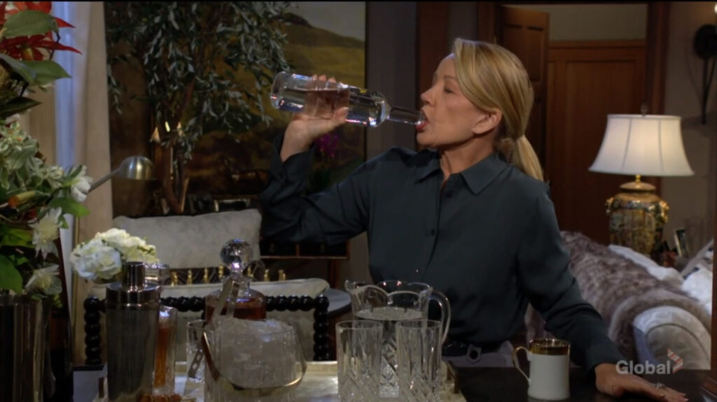 Nikki drinks vodka from the bottle.