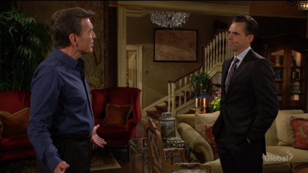 Jack and Billy Abbott talk in the living room.