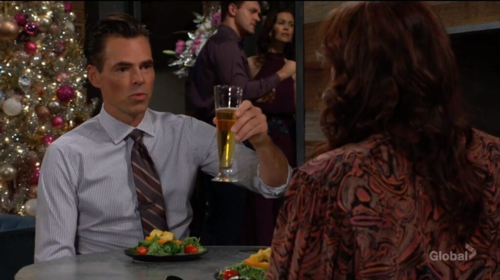 Billy Abbott raises a glass with Chelsea Lawson.