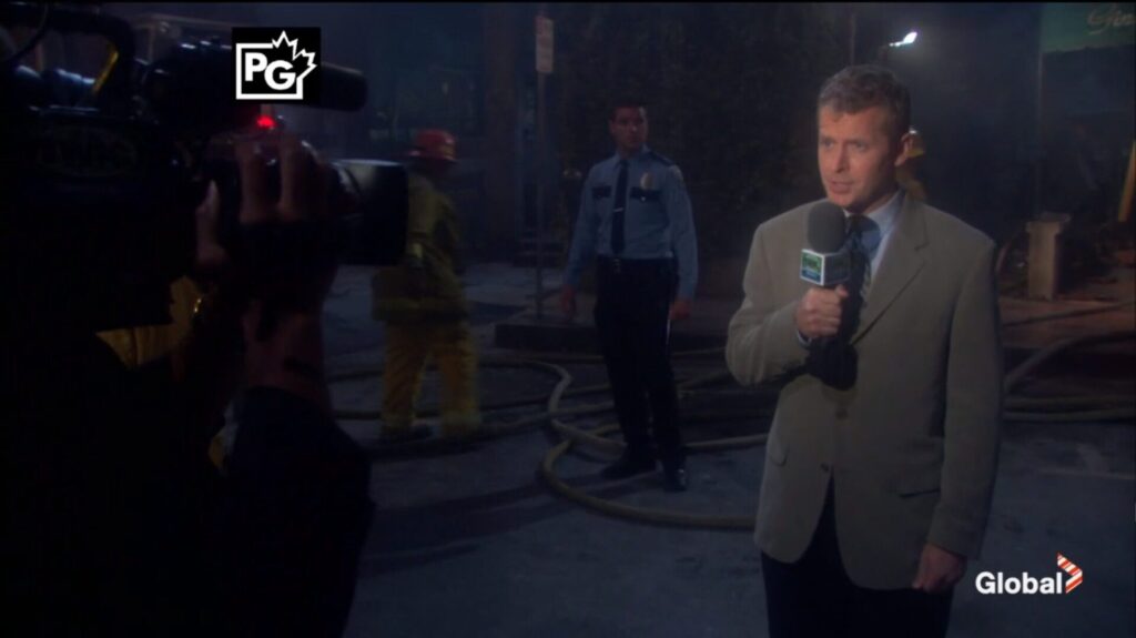 A reporter in front of Gina's Place.