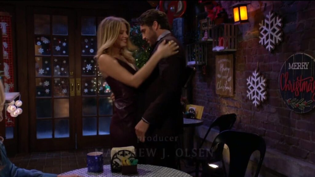 Summer Newman and Chance smile as they embrace.