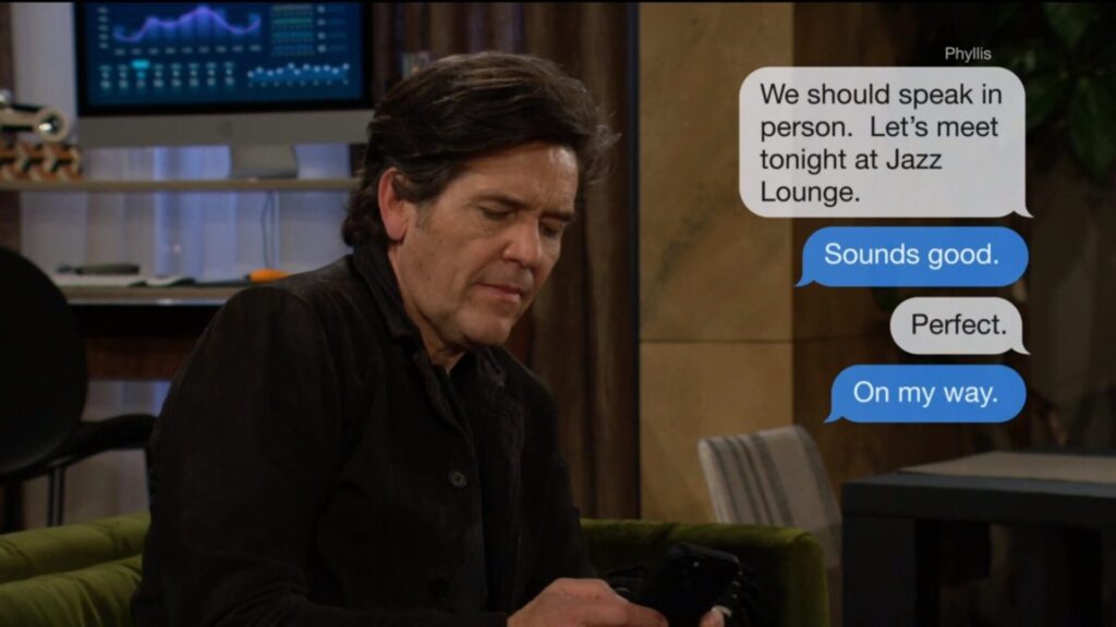 Danny texts with Phyllis.