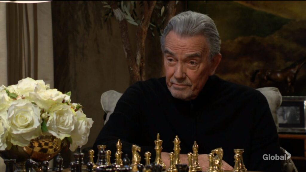 Victor looks at his wife over the chessboard.