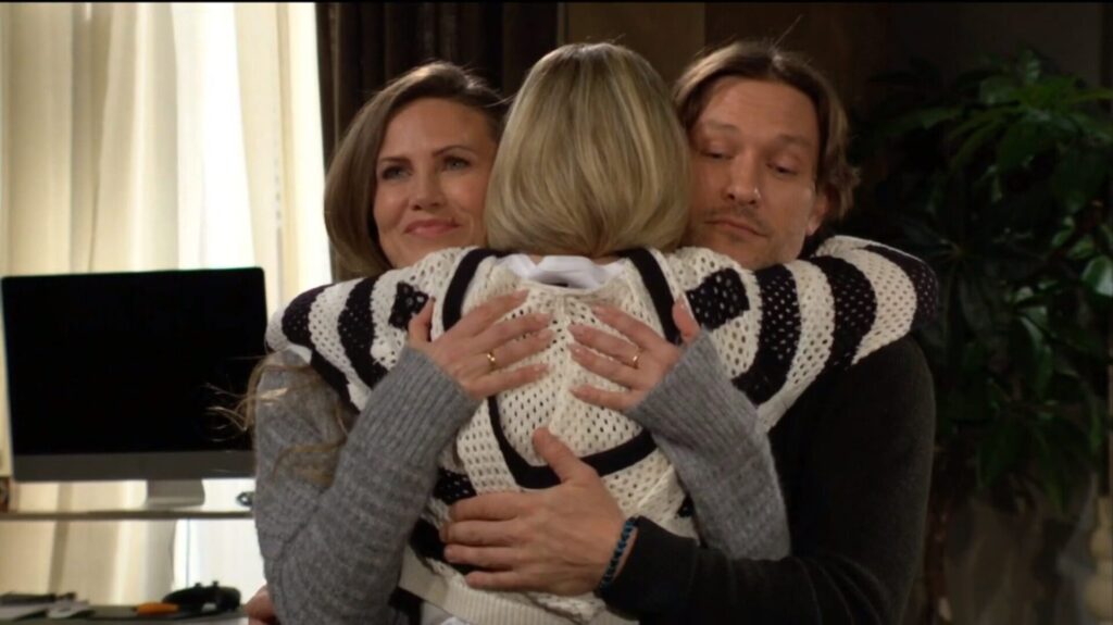 Heather, Lucy, and Daniel hug.