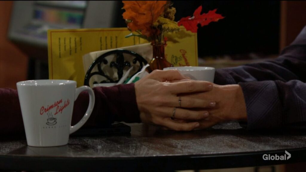 Victoria holds Cole's hand.