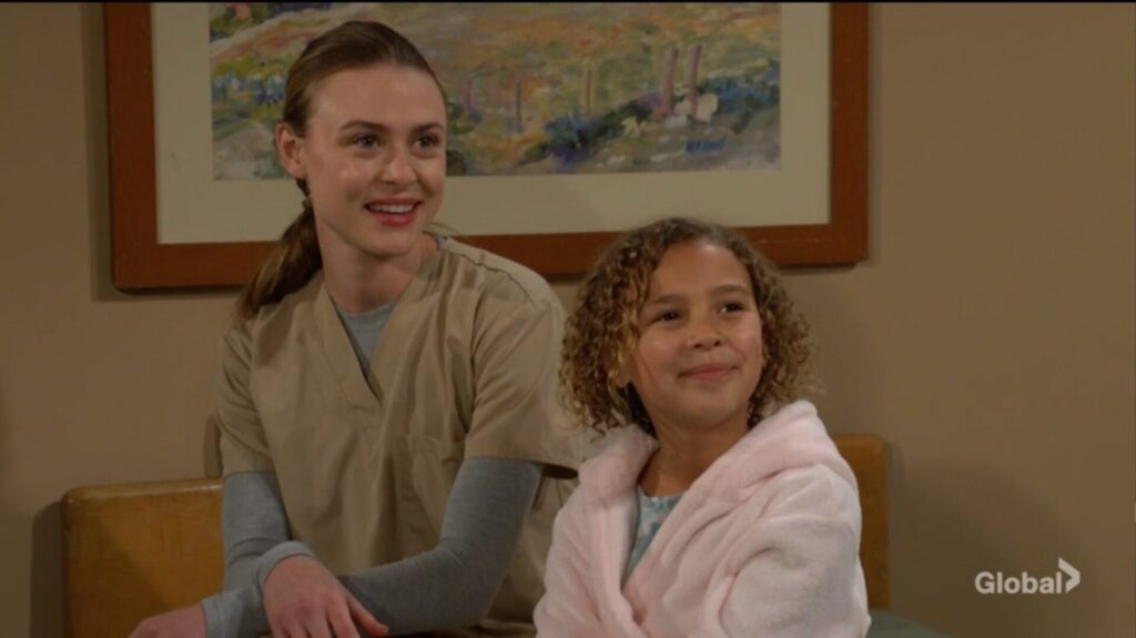 Claire and Nadia smile at Victoria.
