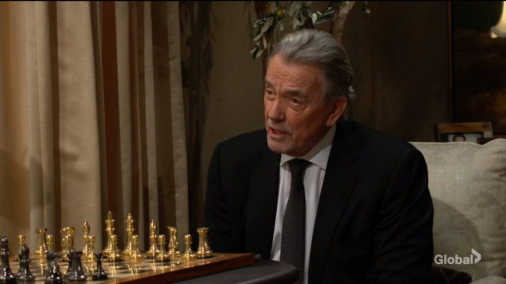 Victor sits in front of his chessboard and talks to Nikki.